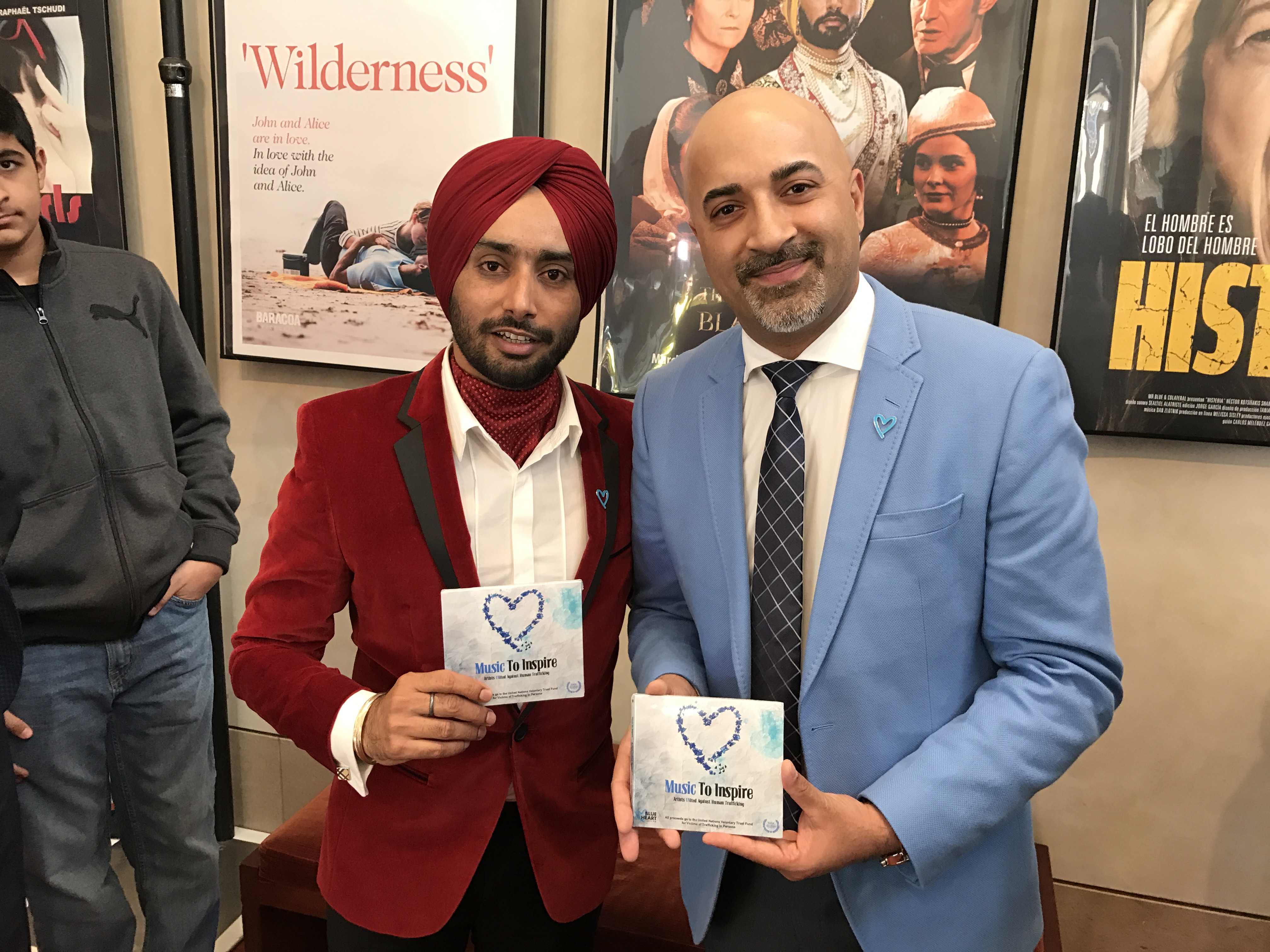Satinder Sartaaj and Sammy Chand holding the Music To Inspire album